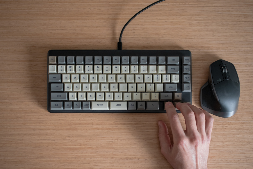 The mouse, in very close proximity to someone's right hand on the arrow keys.